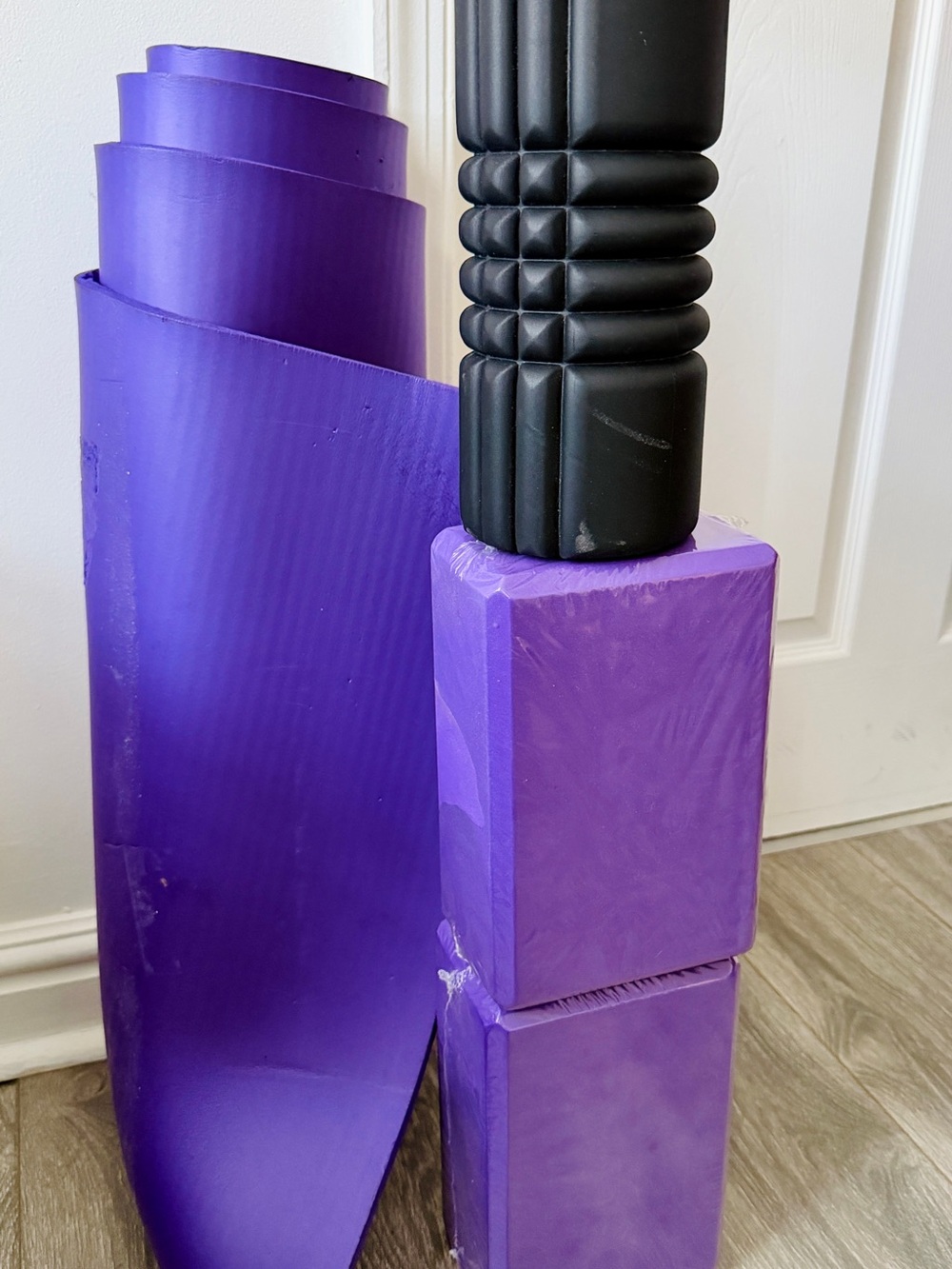 Purple Yoga Mat with Foam Blocks and Black Foam Roller